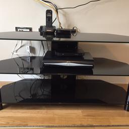 Black Glass TV stand. Previously used for 40inch tv. In great condition.
