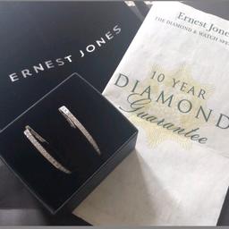 HERE I AM SELLING A BEAUTIFUL BRAND NEW PAIR OF DIAMOND AND WHITE GOLD EARRINGS FROM ERNEST JONES.
THESE ARE 100% GENUINE WHICH ALSO COMES WITH THE RECEIPT AS SHOWN IN THE PHOTOS.
 UNWANTED PRESENT.
RRP IS £250.00

£120.00
LOVELY PRESENT FOR SOME LUCKY PERSON..