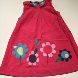This is a lovely pink cord dress 12-18 months although my daughter wore it longer.
Looks lovely with tights. The back is buttoned with three turquoise buttons.
Excellent Condition, lovely dress.