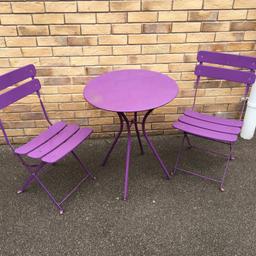 Metal bistro table for sale, which includes one table and two matching chairs. It’s made of metal and is purple in colour. Used but in good condition. It has been stored outside in all weathers and is a little rusty and has a few dinks and scratches but with a little tlc it should come up as good as new. One of the latches on one of the chairs is also a little bent but it doesn’t compromise the use of the chair. Any further questions please don’t hesitate to ask.