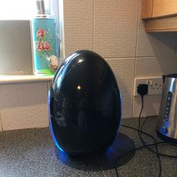 Black mini egg shaped fridge, blue LEDs on the sides, perfect working order.
