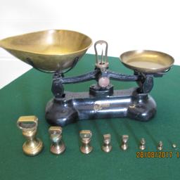 Old fashioned scales with brass weights.
