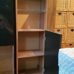 Lovely cabinets that can be wall mounted or floor standing walnut glass n black gloss.. shelf in each section... 4 foot high 16 inch wide 12 inch deep... no damage immaculate £40 each or both £70 can del local