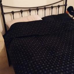 Double bed frame, really dark brown looks almost black. 
Metal frame, no broken slats. Head and foot boards.
