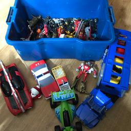 Lorry transporter with 2 cars. Toy story car, a helicopter and lots of different cars.