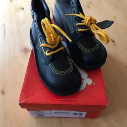 Child's size 1 black kicker boots with yellow stitching and laces. Never worn.