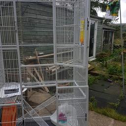 Large bird/chipmunks/chinchilla cage 
Excellent condition with 2 large doors and 8 small access doors 
Comes with stand on casters for easy moving 
Can be a stand alone  or on its stand 
Size height 1760mm on stand 
Height off stand 1350mm 
Width 770mm 
Depth 465mm 
Comes 2 shelves, a wheel, toys, perches and drinks bottles X2