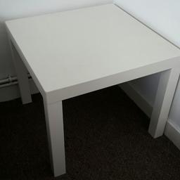 little white table is available to be pivked up for a new home