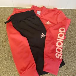 Girls old skool adidas tracksuit.
Bnwt only tried on daughter didnt like it.
Colour PINK & BLACK
Varsity style jacket with logo on chest and 'adidas' down left arm.

Drawstring waist and elasticated cuffed ankle 'adidas' down left leg.

Only bought in may this year for birthday present.
Paid £55 from FOOT ASYLUM in London.
Age 14 check photo for label.
£18.00ono