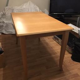 Medium pine coloured extendable dining table. Seats 6 and when extended seats 8. The table is in excellent condition. Unextended measurements are 50 x 28 x 30 inches (L x W x H). Extended measurements are the same but the length of the table is 62.5 inches. Pick up from London NW4 only. Cash only.