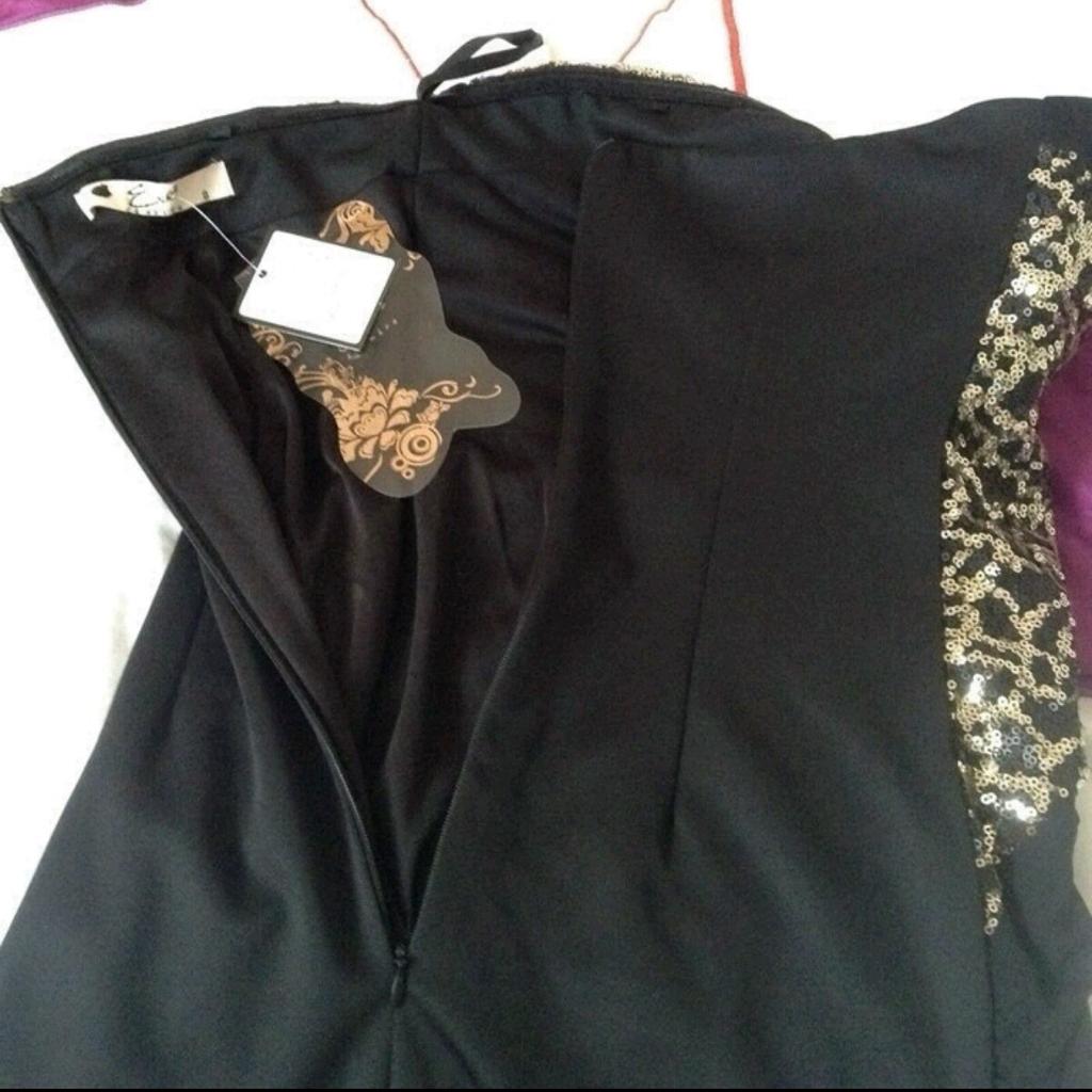 Brand new with tags, size 8. Black and gold sweetheart dress.

Open to offers.