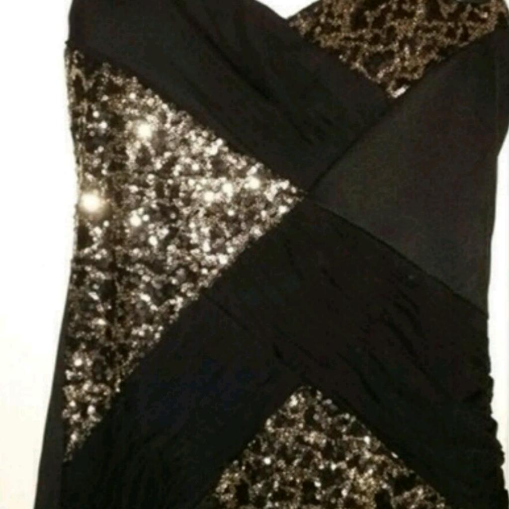Brand new with tags, size 8. Black and gold sweetheart dress.

Open to offers.