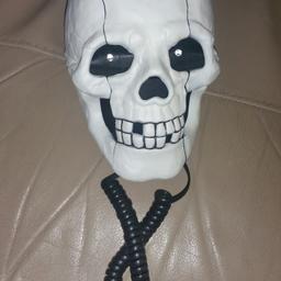 Novelty skull house phone. Eyes light up when someone calls works perfect