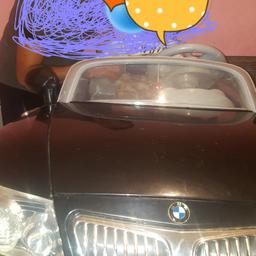 Bmw kids ride on car in very good condition hardly used going to sell because dont have enough space comes with charger and remote two seater and 12v collection only