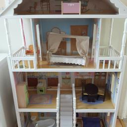 Beautiful wooden doll house with wooden furniture included. Some oil stains. Second floor has collapsed but can be fixed by someone who knows how.