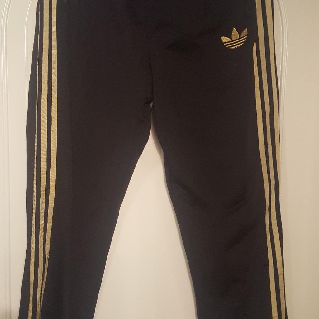 Tuta adidas clearance nero oro