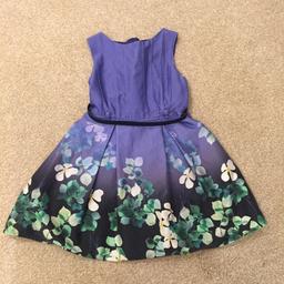 Blue girls dress with flower pattern age 5 with belt. 
Worn but in excellent condition