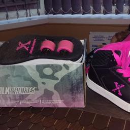 Size 11 pink and black heelies in mint condition rarely used
