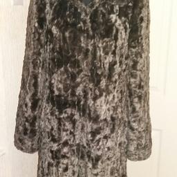 Lovely long grey fur look coat with silver lining. Bought from Principles in Debenhams. Size 8.
Only worn a couple of times.
Great for Christmas parties and nights out.
Collection only from Bolton upon Dearne.