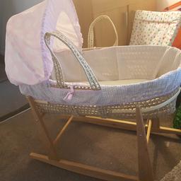 Lovely pink moses basket with  matching blanket and rocking stand included.

Selling as no longer needed and no room to store it.

From smoke free home. Collection only. Willing to discuss offers.