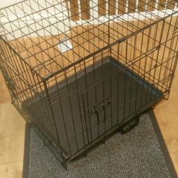 Small dog cage. New unused. Suitable for small breeds or puppy. Folds down inside it self. 2 doors, 1 on front and 1 on side. Still has tag attached.