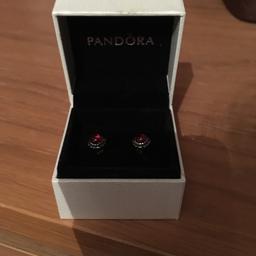 Never worn.....unwanted gift.january birthstone earrings in pandora box with bag