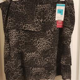 Bought but never worn as too short for me. Layered style in sheer type fabric in animal print grey / black. Lined. Original £29.50 price. Collection or postage extra