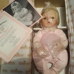 Sugar Plum is an Ashton Drake collectable doll, she has porcelain hands and face and all porcelain is perfect condition.

She had been on display, so a little dust on clothing but other than that absoluteperfect condition.

Comes complete with certificates.