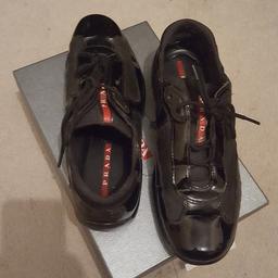 Prada trainers in decent overall condition. Have some signs of wear especially on the inside back. One hundred percent genuine. Size 8 UK If I'm not mistaken