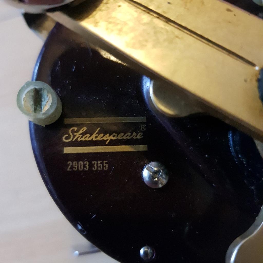 A Shakespeare Neptune fishing reel together with a