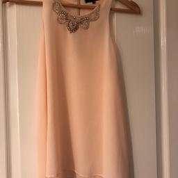 Gorgeous layered chiffon top. Peach with embellished jewels on neckline. All intact - none missing.
Size 12.
Lovely condition just not my colour at all.