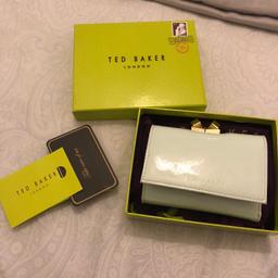Ted Baker purse with gift box and duster bag!

This purse has been used although in brilliant condition, a few leather folds/creases but otherwise good condition.