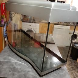 40 inch by 10 inch by 18 inch high fish tank with bow front comes with woring light I do not deliver