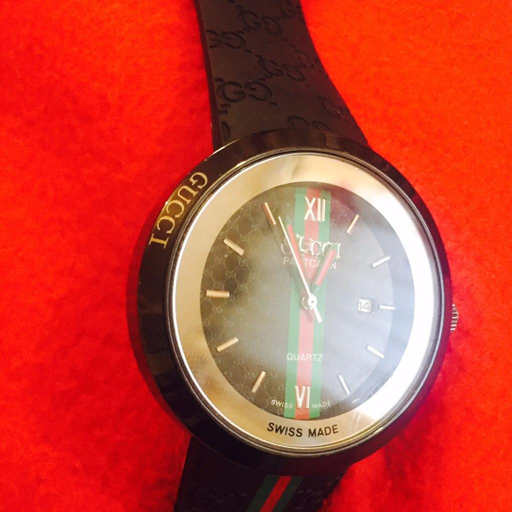 Gucci watch swiss best sale made code ref 1142