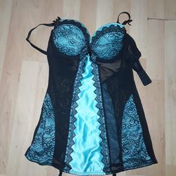 Perfect condition, UK size 14. Has removable padding and stocking clips. Colour is turquoise with lace pattern. Collect only b69