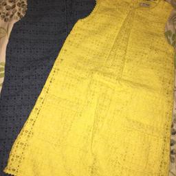 2 crocheted dresses from NEXT lemon and denim blue colours, never worn but tags removed. Pockets on the front and buttons all the way up the back. Dresses are lined inside