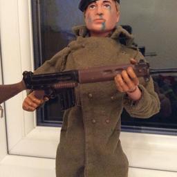 Vintage retro Action Man 1964 by Palitoy in Commando Uniform. Blonde real hair effect with blue eyes. Rubber grip hands so an excellent early example. Complete with Coat, trousers, boots, Beret & Rifle. No talking mechanism.