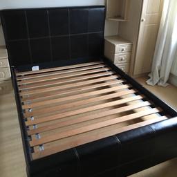 Brown double bed 
Leather head board