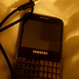 Its a samsung pro key pad and touch screen phone  comes with usb cable justed need the plug and its unlocked