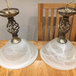 Two twisted ceiling lamps with glass shades. Working fine just need wiring up