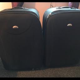 2 large black suitcases, never used ,excellent condition x