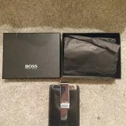 Hugo Boss money clip - never been used.

Purchased as a gift but never given as has a very small mark on the front.

Smoke free home.