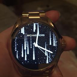 MK access smart watch gold tone. Small hairline crack at very top of glass but still usable and doesn’t effect quality of watch. Can be fixed in market but I don’t have time. Links been removed for smaller fit but I still have the spare links. Boxed and comes with charger and instructions.