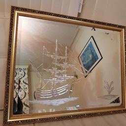 Like new condition mirror. No scratches or blemishes. Beveled edges with gold designed frame. Internally engraved ship on 1 side and palm tree on other side. Looks beautiful