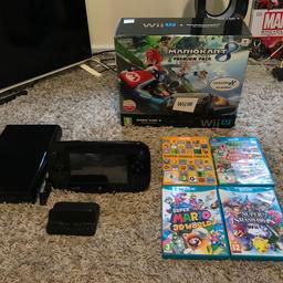 Here we have for sale my beautiful loved Nintendo wii u premium MARIO mart 8 edition 

Brought Christmas 2016 so only a year old and well looked after and not played by younger kids!
It comes with all accessories and wires 
6 games included are 
MARIO kart 8 installed on console 
Super Mario maker (amazing game)
Super Mario 3D world 
Super smash bros wii u
Animal crossing amiibo festival 
New super Luigi bros (disk sometimes says unreadable so not sure if this is fully working as brought pre own