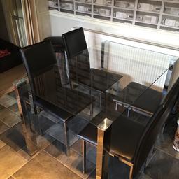 Glass table with metal mirrored legs
With 4 chairs
2 of the chairs are ok but stitching has come loose on the other 2 chairs as seen in the pictures
Table is in good condition no chips or marks
Collection only
£40