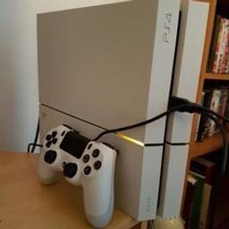 White PS4 plus 8 games as shown in picture. Comes with 1 controller and all leads. Excellent condition.

Drakes fortune collection 1-3
Drakes Fortune 4
Batman Arkham Knight
The evil within
The walking dead season 2 (game)
COD black ops 3
Homefront
Metro Redux
