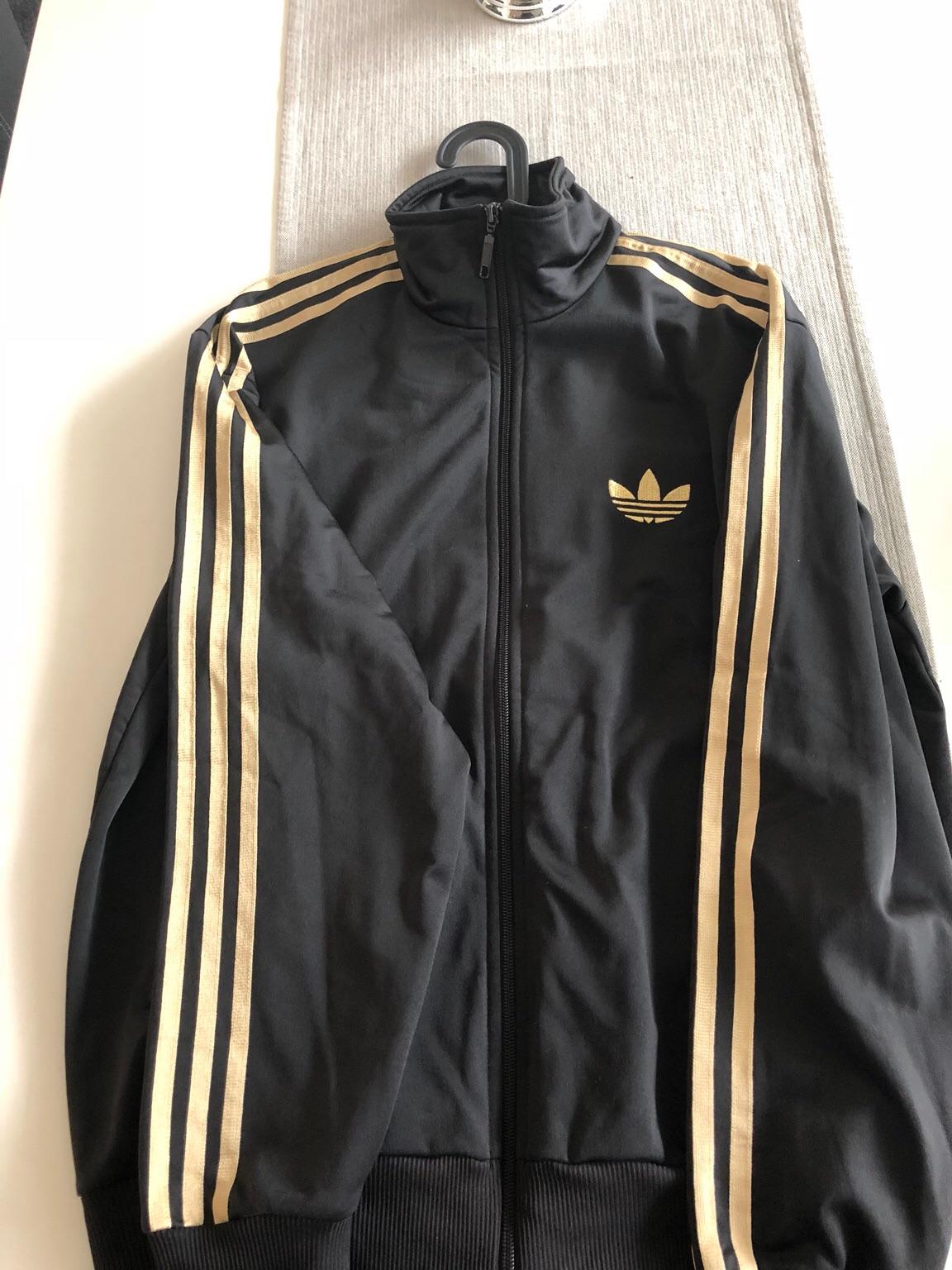 Adidas schwarz cheap gold jacke