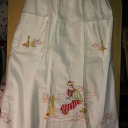 Vintage White linen clean no marks .. half apron with embroidered Hungarian lady in traditional costume .. with pockets to!! a nice tourist souvenir from times gone by