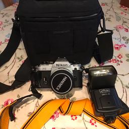 Nikon slr camera, 35mm film, comes with bag & flash.